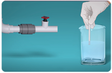 Hand stirring water in beaker for testing sample