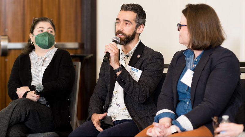 Matheus speaking at a conference