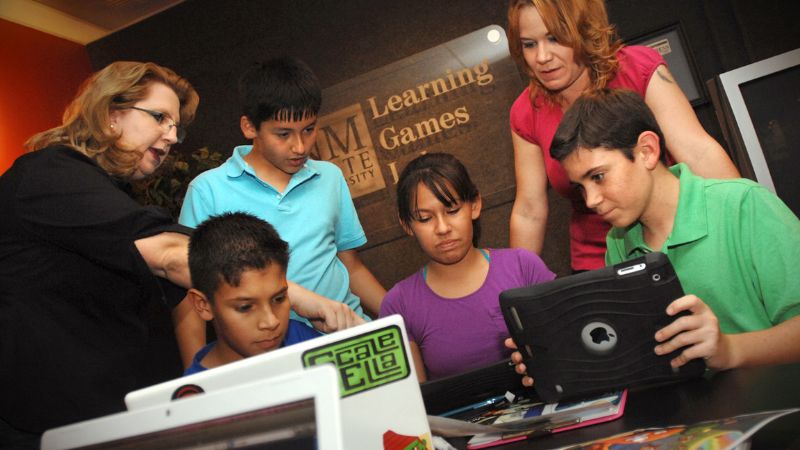 Barbara Chamberlin working with students in the Games Lab