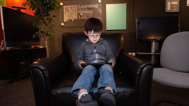 Child playing game on his ipad